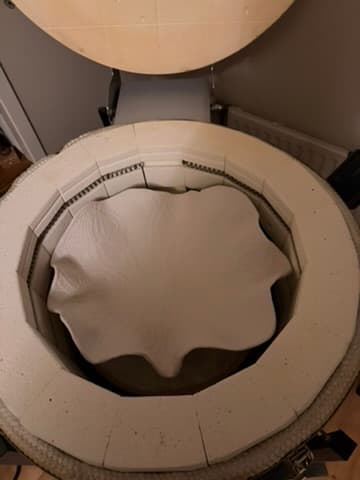 A bowl inside the open ceramics kiln in the studio