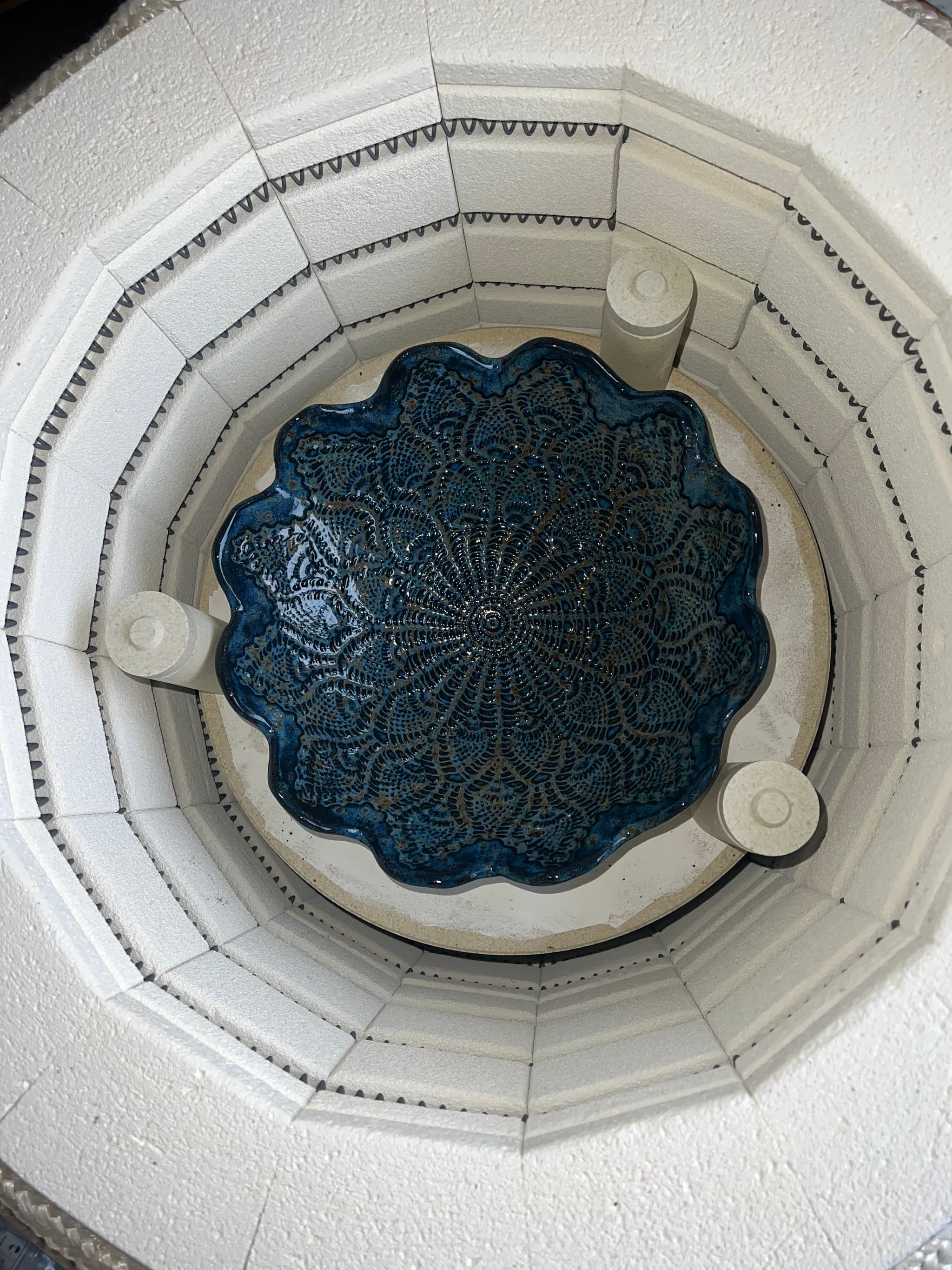 Bowl with blue glaze in the ceramics kiln